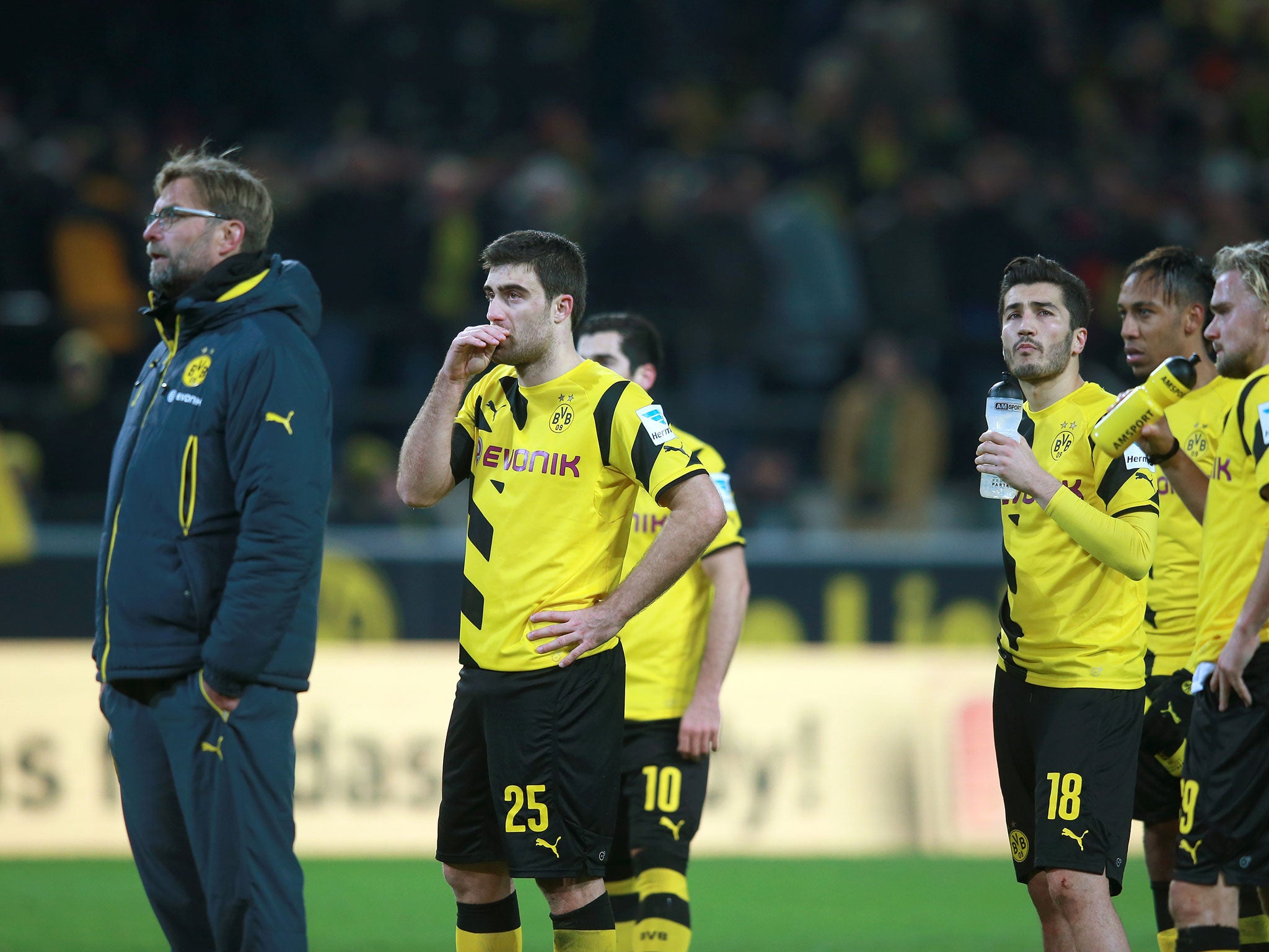Jurgen Klopp (left) and his Dortmund players look on