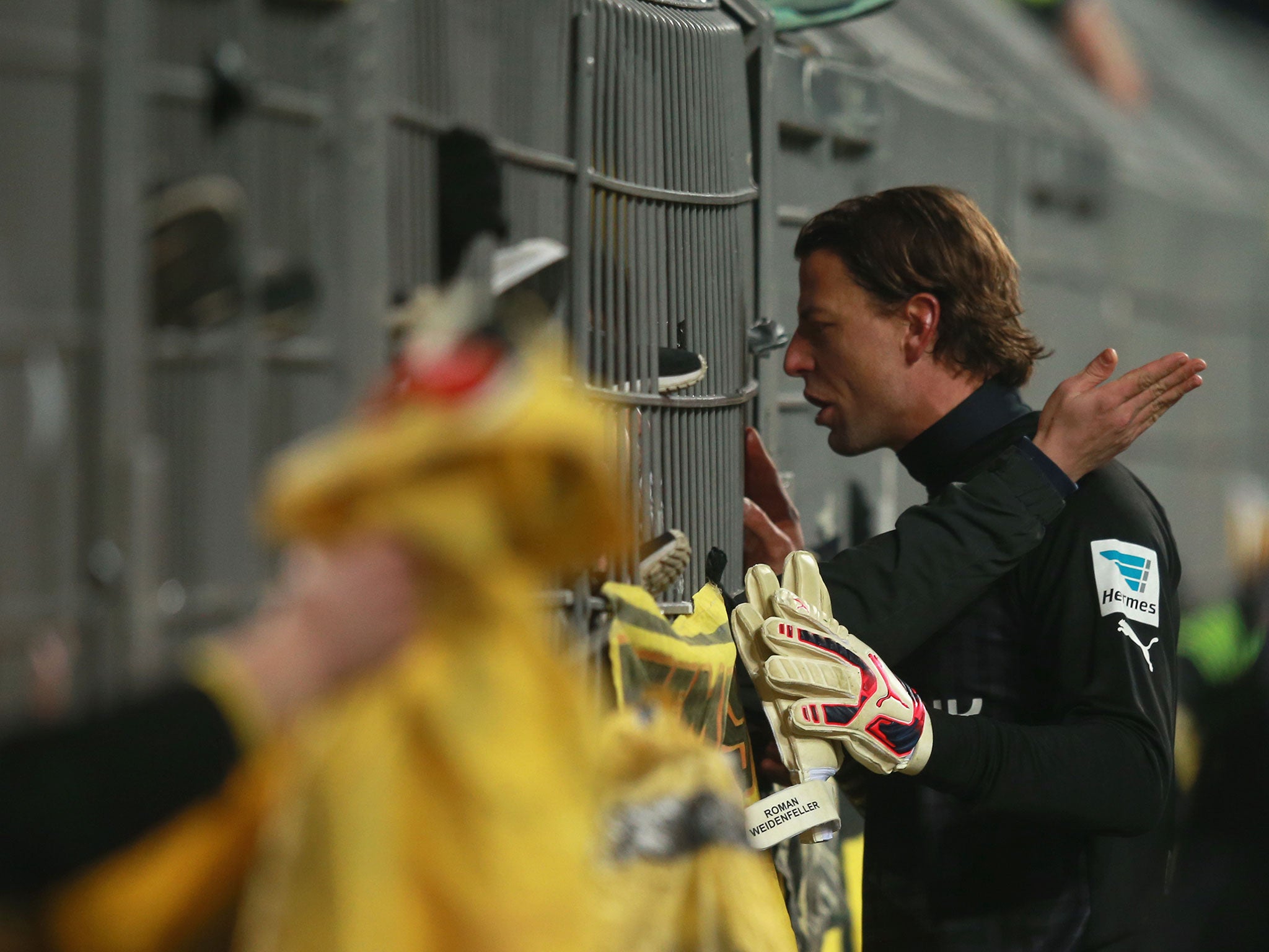 Roman Weidenfeller speaks to fans through the fence