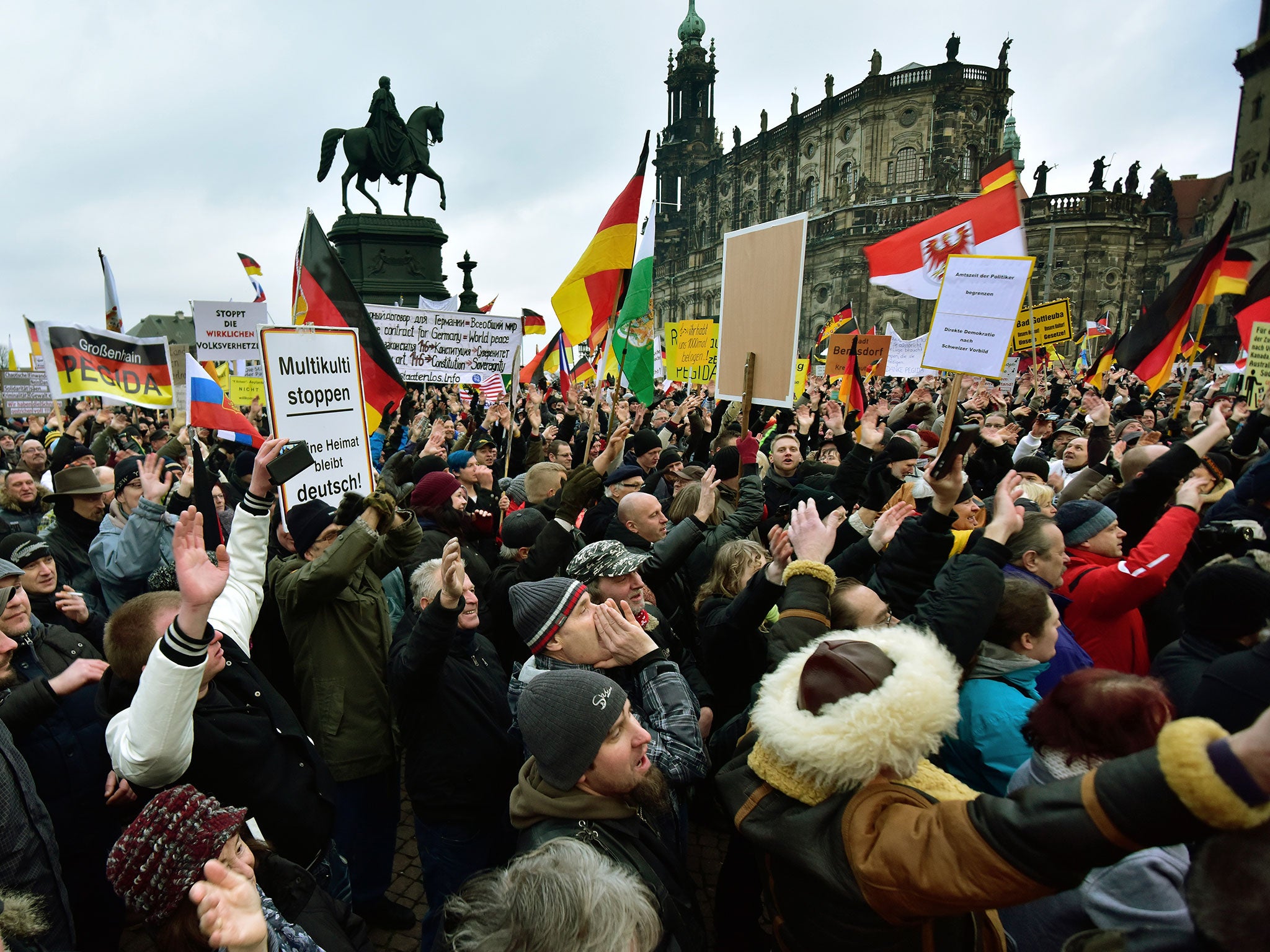 Supporters of the Pegida movement pictured during their weekly demonstration last month