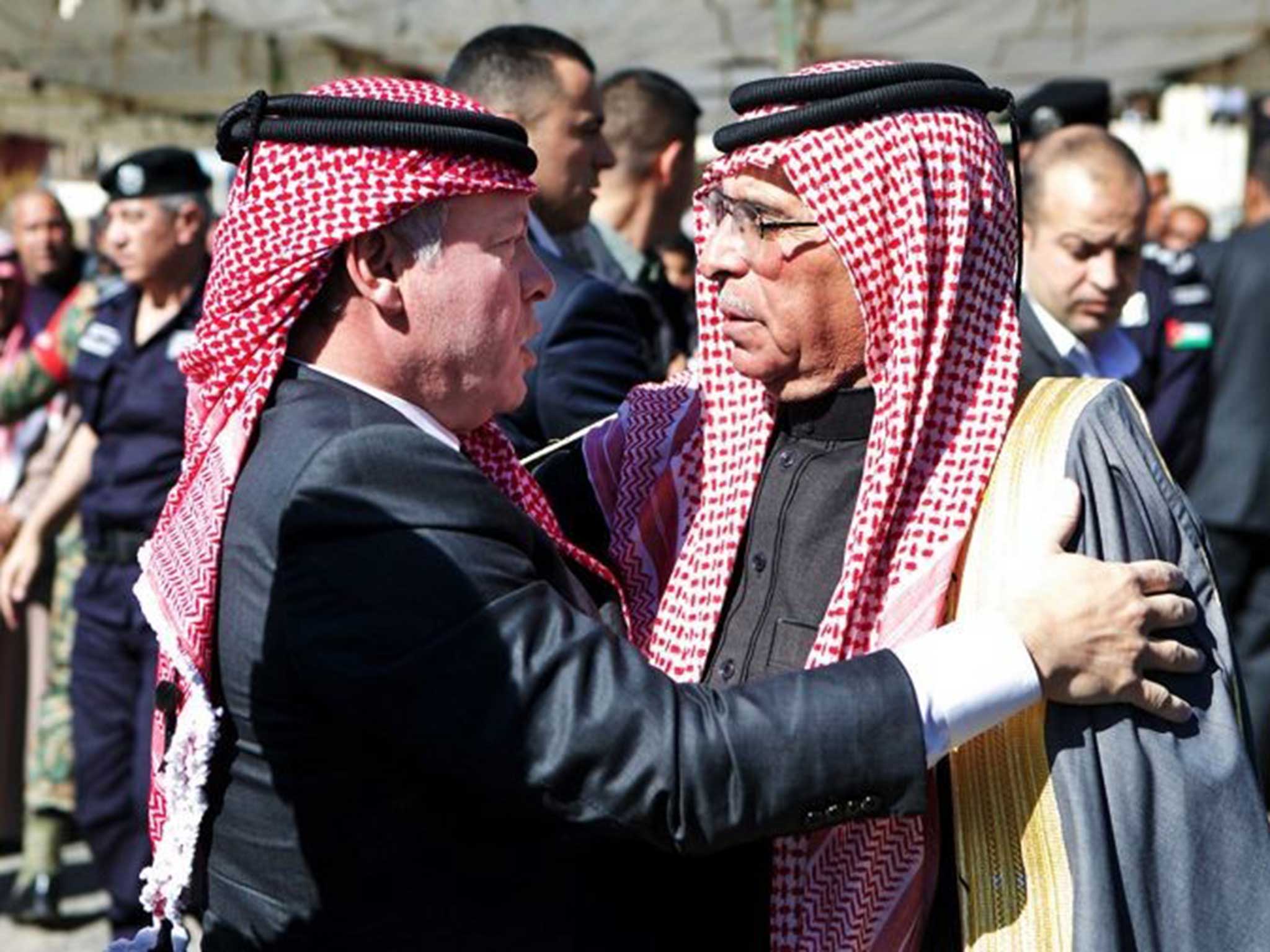 King Abdullah embracing his father Saif (on right)