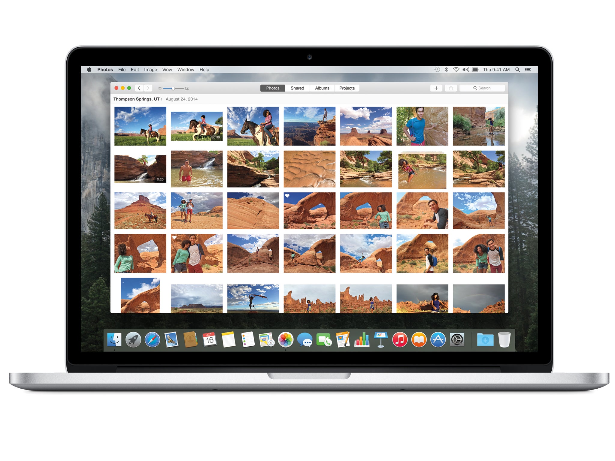 The 'Moments' view of the new Photos app, shown on a MacBook Pro