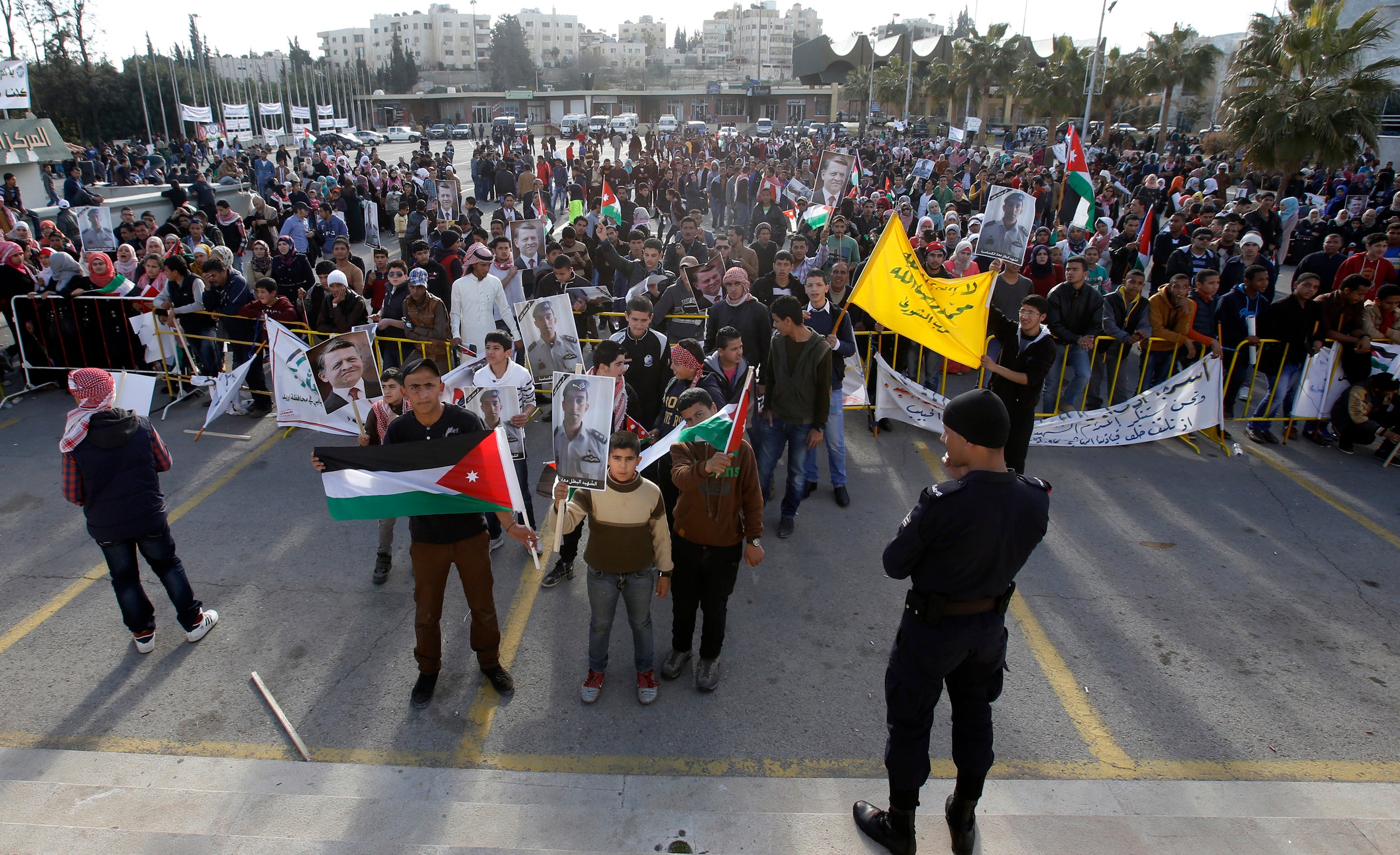 Jordanians hold a rally to show their support for the government against terror in Amman, Jordan