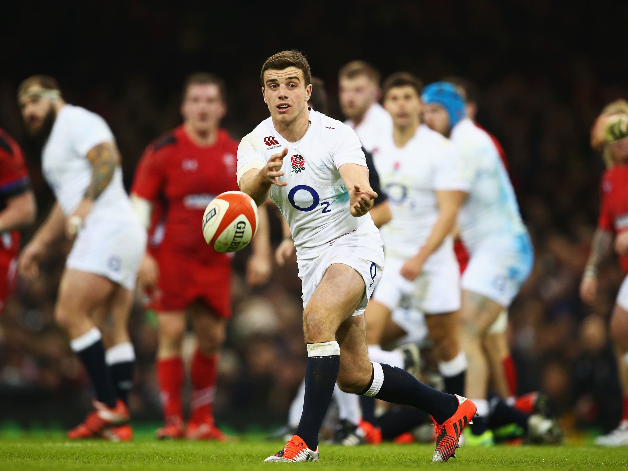 George Ford (left) makes a pass