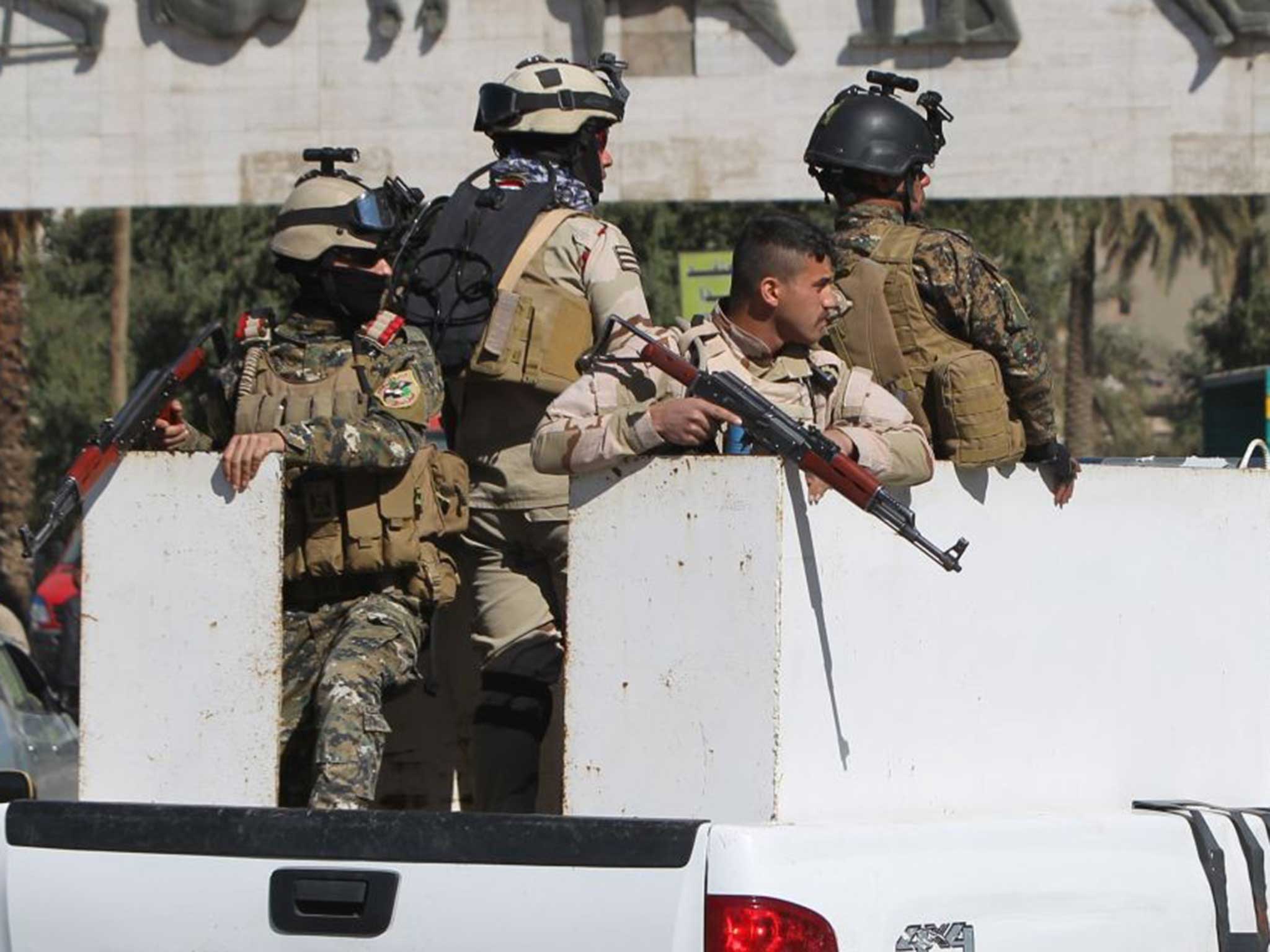 Iraqi soldiers patrol the capitol Baghdad