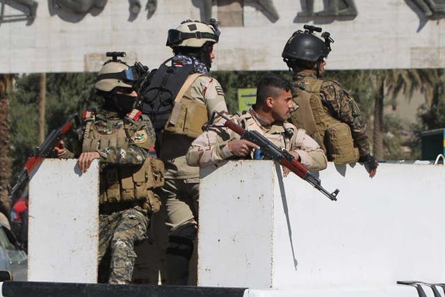 Iraqi soldiers patrol the capitol Baghdad