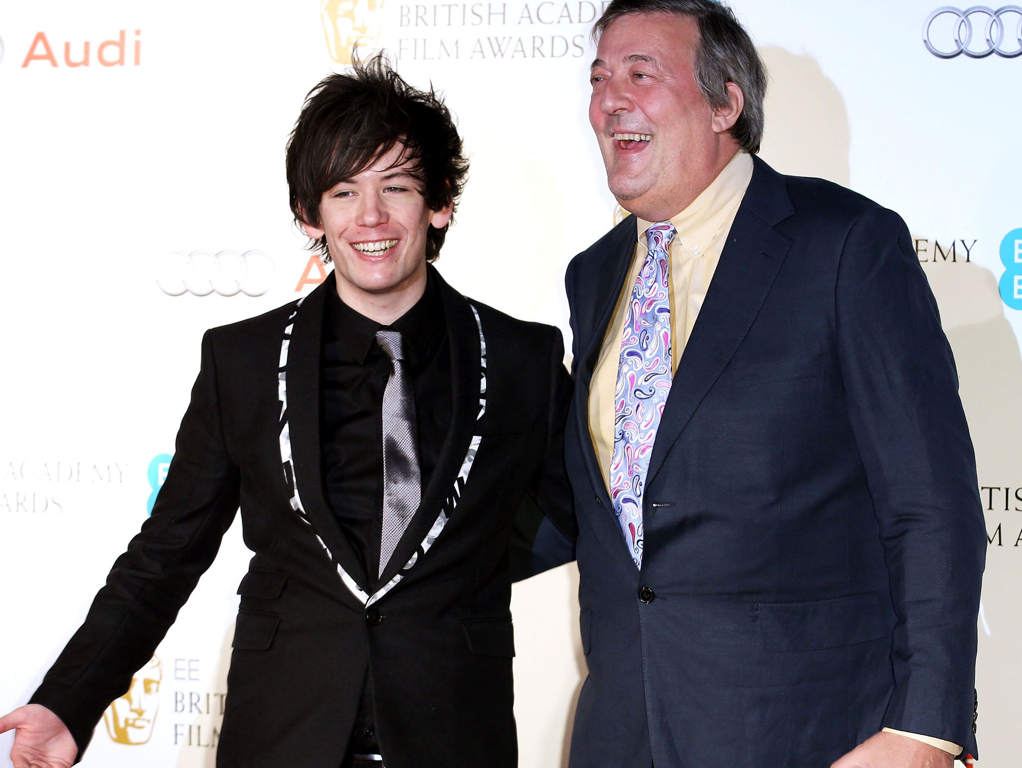 Elliott Spencer and Stephen Fry make their first public appearance as a married couple at a pre-BAFTAs party