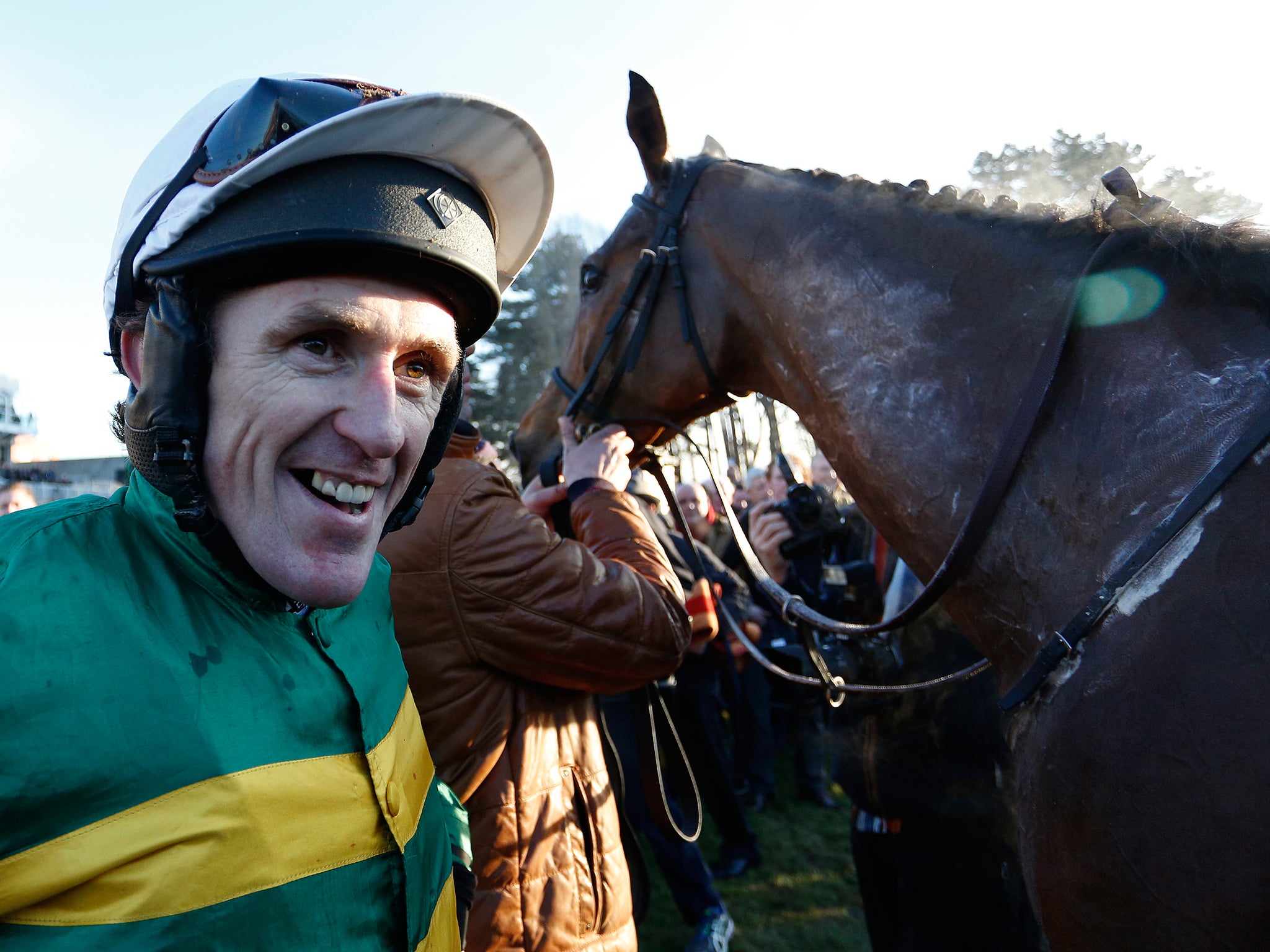 Tony McCoy riding Carlingford Lough return after winning The Hennessey Gold Cup at Leopardstown racecourse