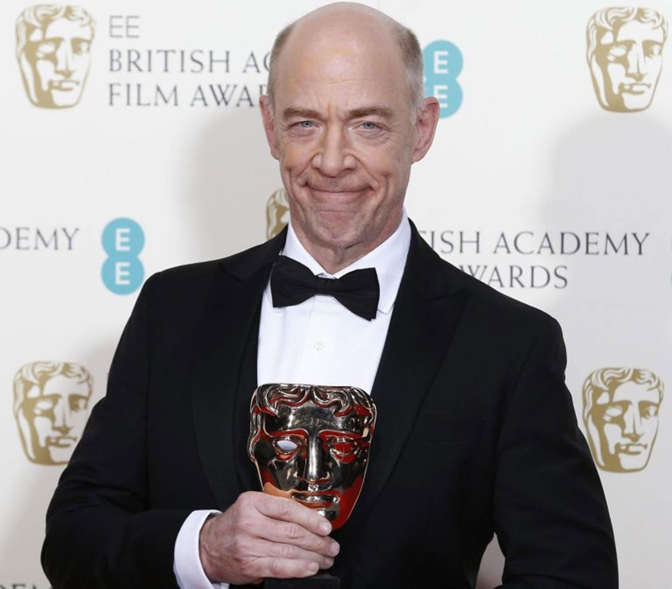 J.K. Simmons celebrates after winning best supporting actor for "Whiplash" at the BAFTA awards ceremony