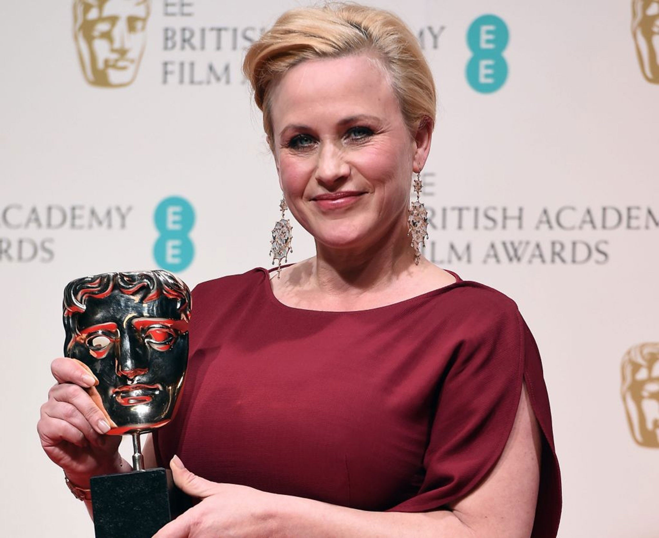 US actress Patricia Arquette poses in the press room after winning the Best Supporting Actress award for her performance in 'Boyhood' during the BAFTAs