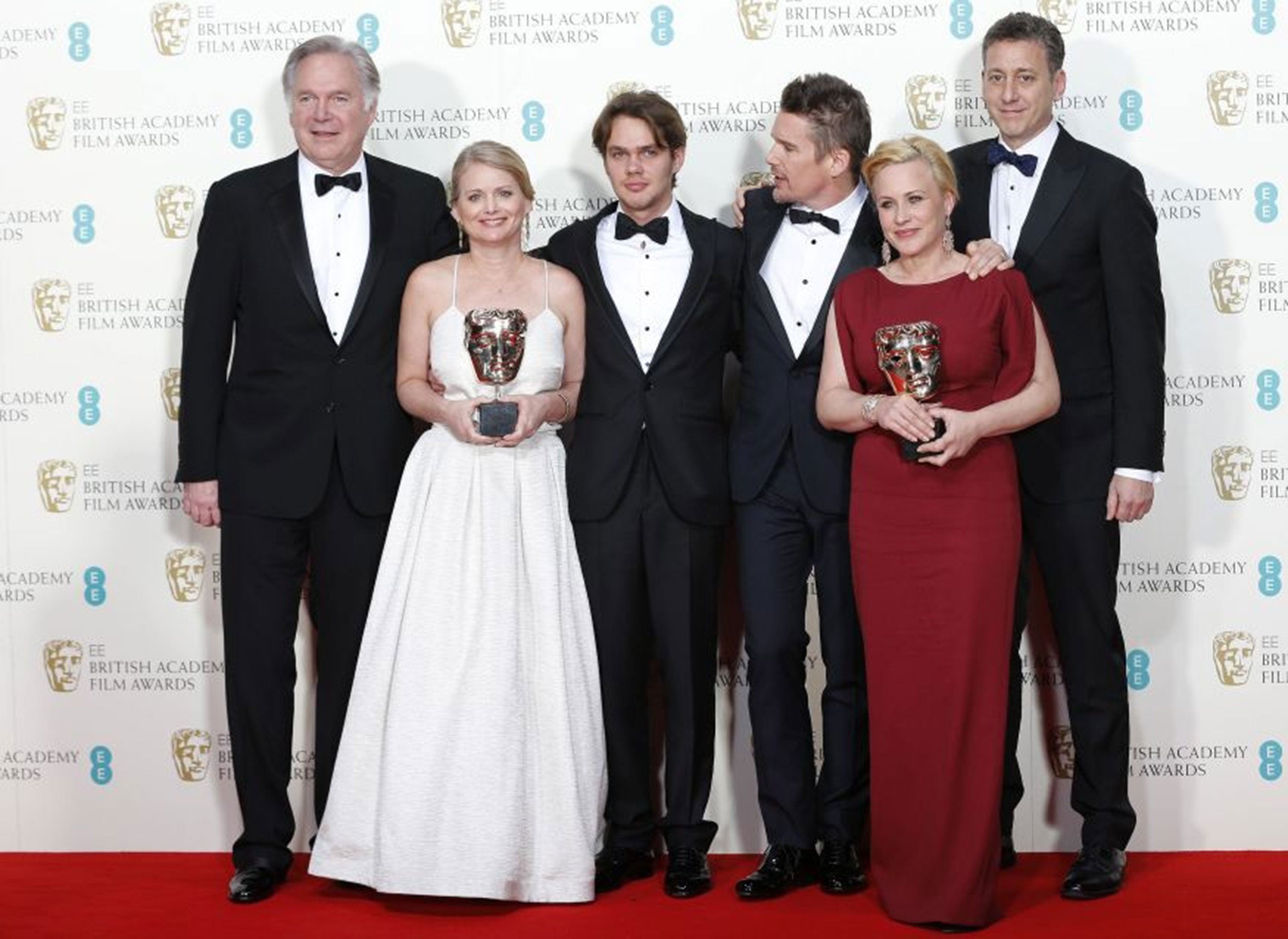(Left to right) Jonathan Sehring, Cathleen Sutherland, Ellar Coltrane, Ethan Hawke, Patricia Arquette and John Sloss celebrate after winning the best film award for Boyhood at the Baftas