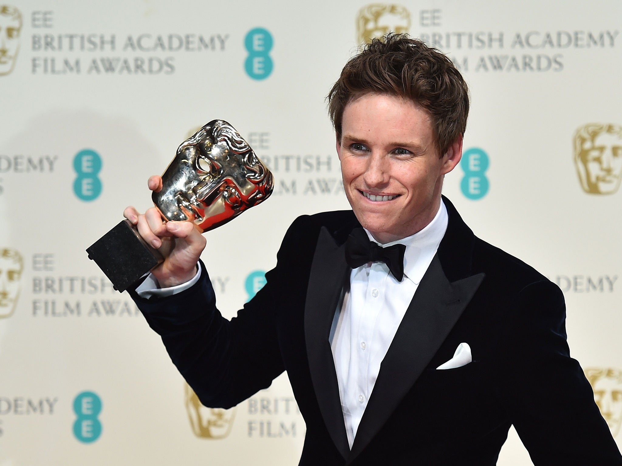 British actor Eddie Redmayne poses with the award for a leading actor for his work on the film 'The Theory of Everything' at the BAFTA British Academy Film Awards at the Royal Opera House