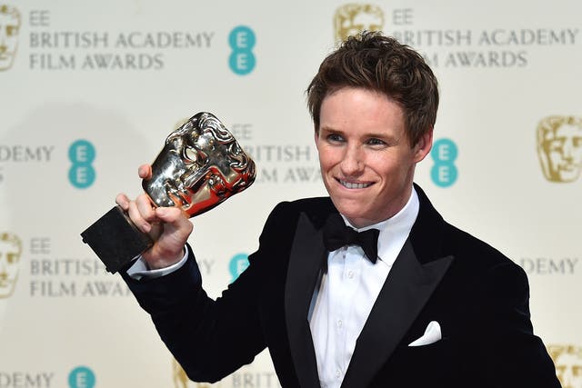 British actor Eddie Redmayne poses with the award for a leading actor for his work on the film 'The Theory of Everything' at the BAFTA British Academy Film Awards at the Royal Opera House 