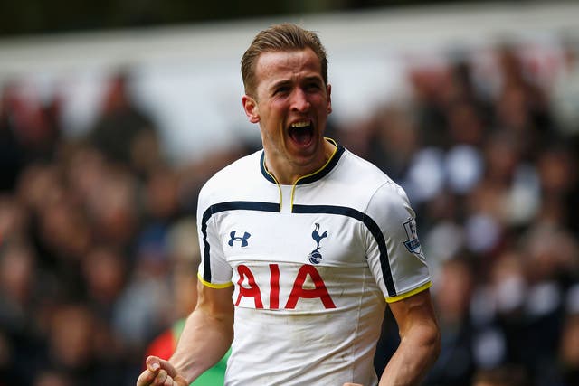 Tottenham striker Harry Kane celebrates scoring against Arsenal