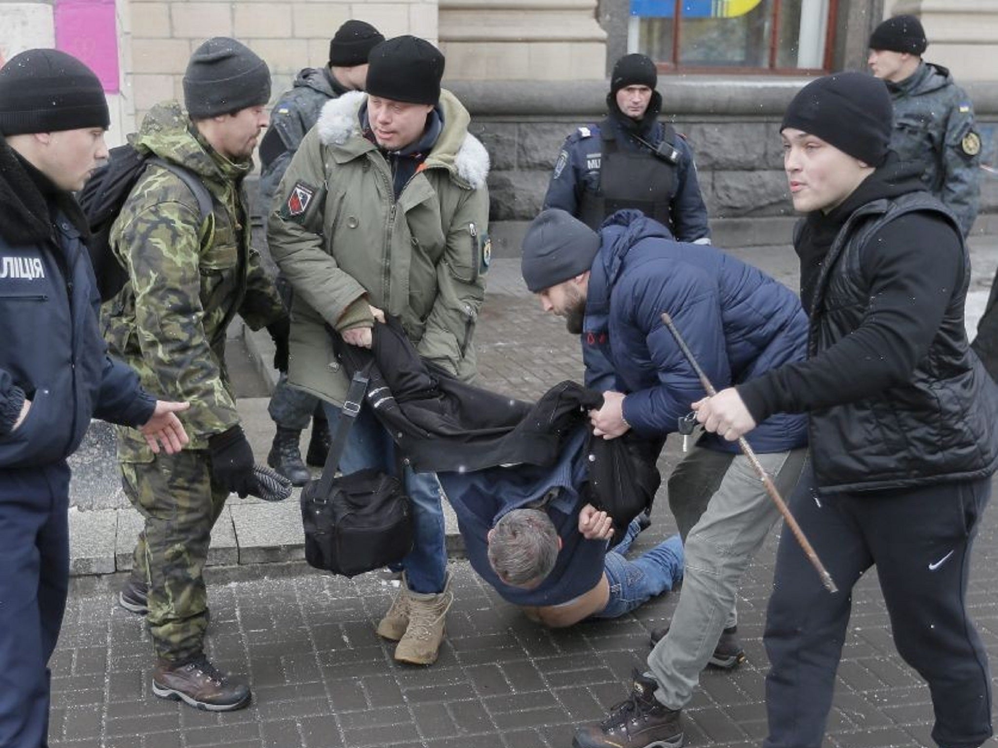 Ukrainian policemen and volunteers arrest suspected terrorists in Kiev