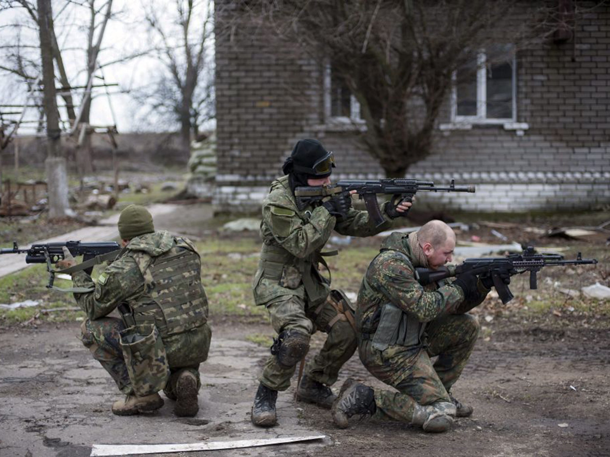 Volunteer servicemen patrolling the streets during military training near Mariupol