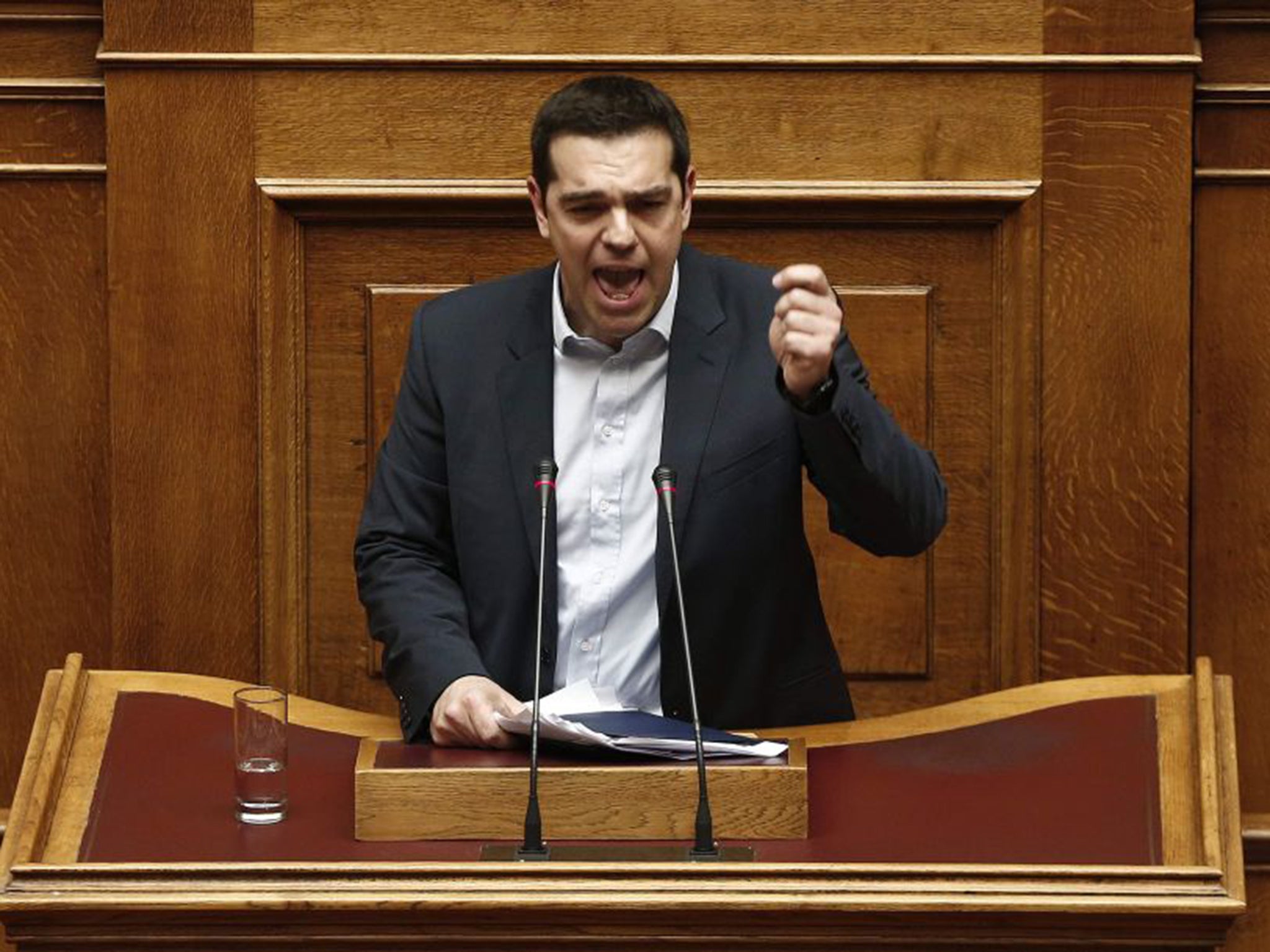 Alexis Tsipras delivers his first major speech in parliament in Athens on Sunday