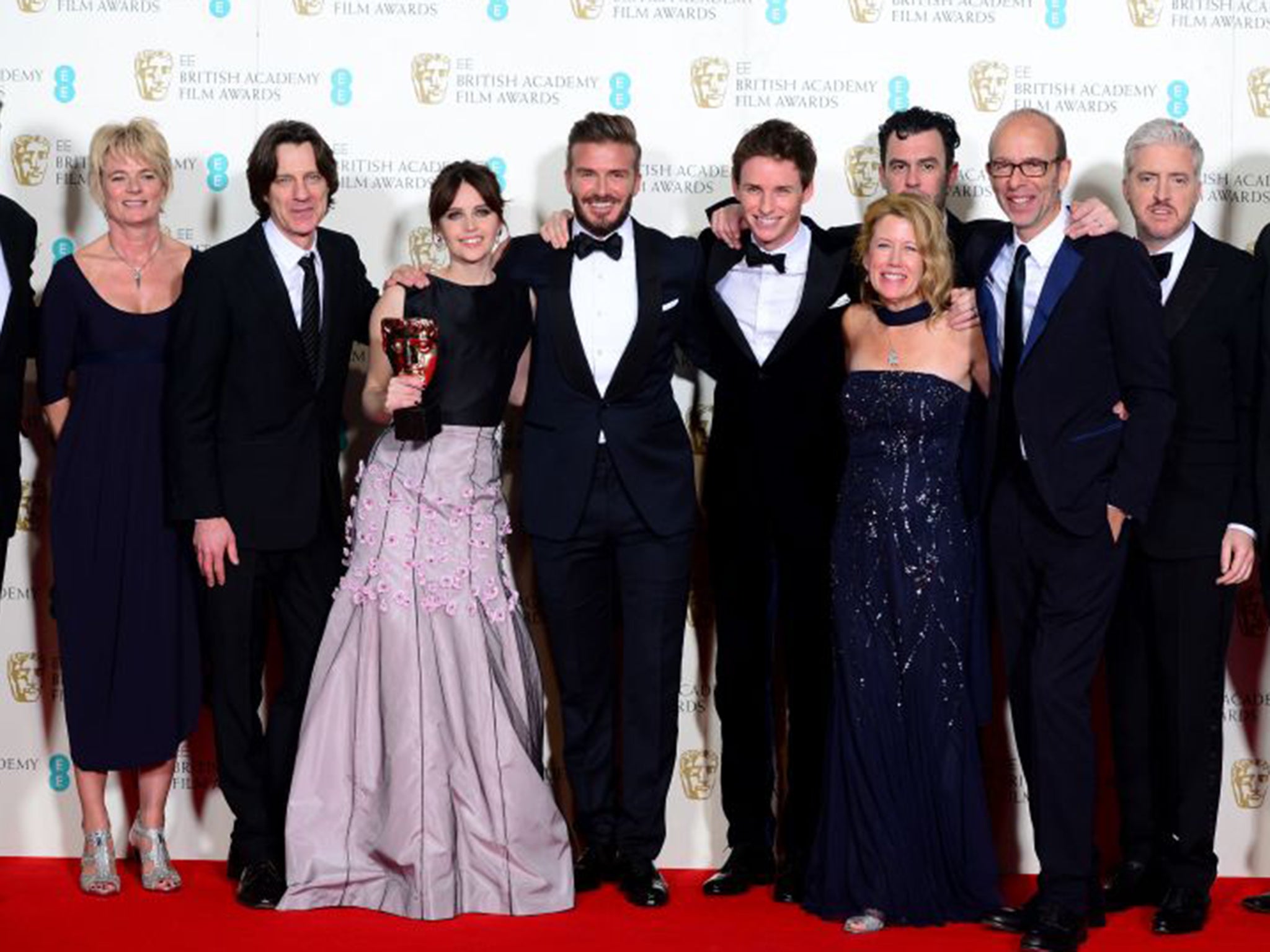 Eddie Redmayne and Felicity Jones alongside Baftas presenter David Beckham (centre) after the awards ceremony