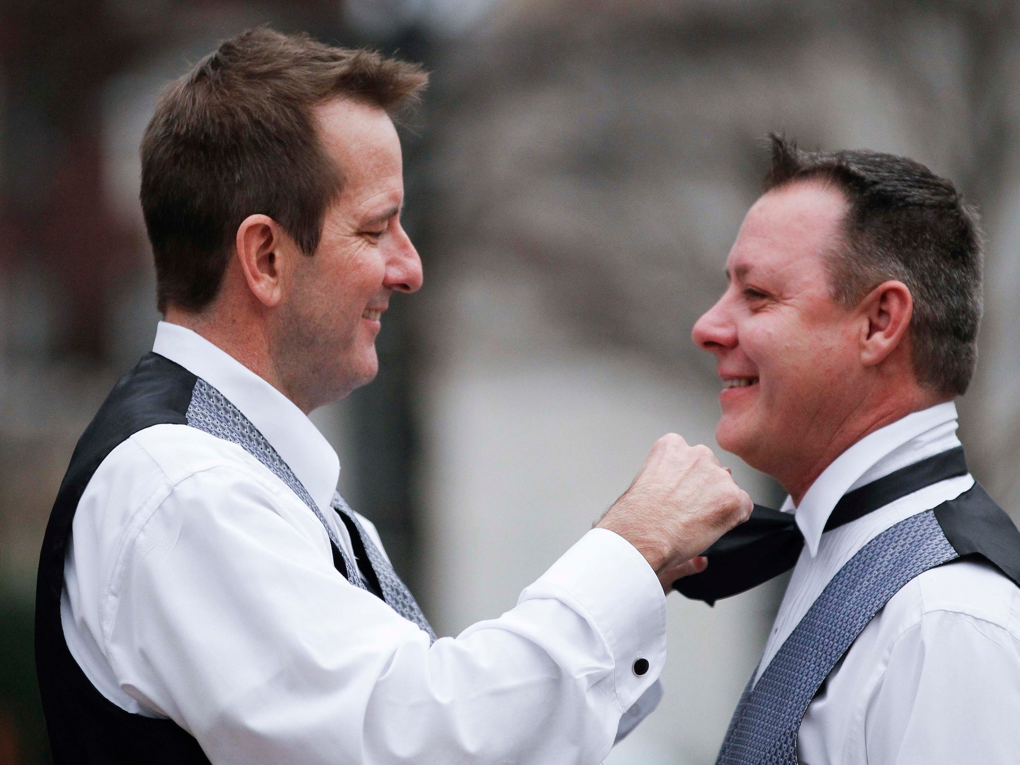 A couple who gave their names as Greg and Roger prepare to get married in Birmingham, Alabama on Monday