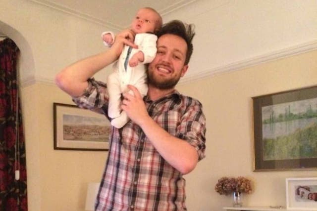 Baby bond: writer Will Dean at home with his newborn baby, Johnny