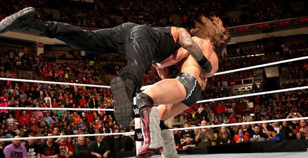 Reigns delivers a spear to Bryan at the end of Raw