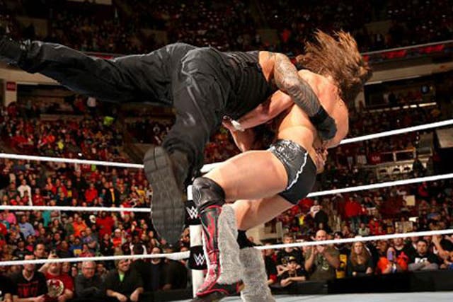 Reigns delivers a spear to Bryan at the end of Raw