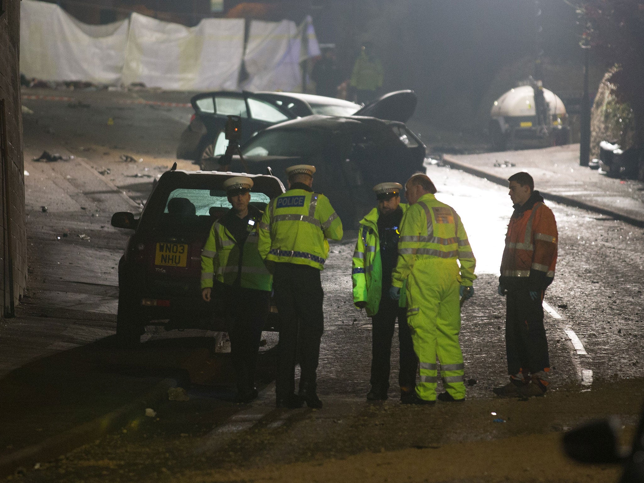 Police continue their investigations at the scene of a fatal road traffic collision involving a lorry and a number of cars in Bath