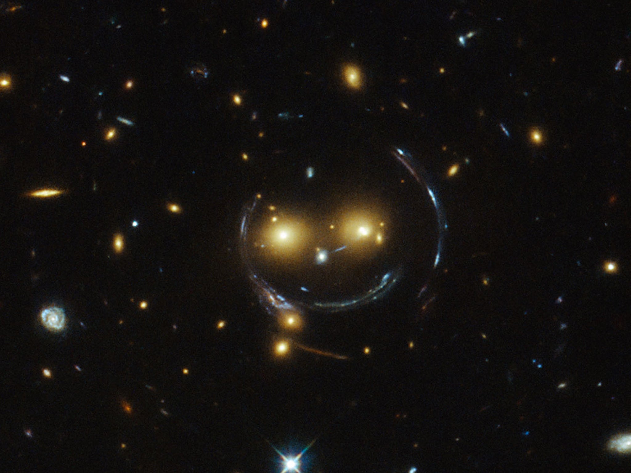 The galaxy cluster SDSS J1038+4849 — not actually a smiley face