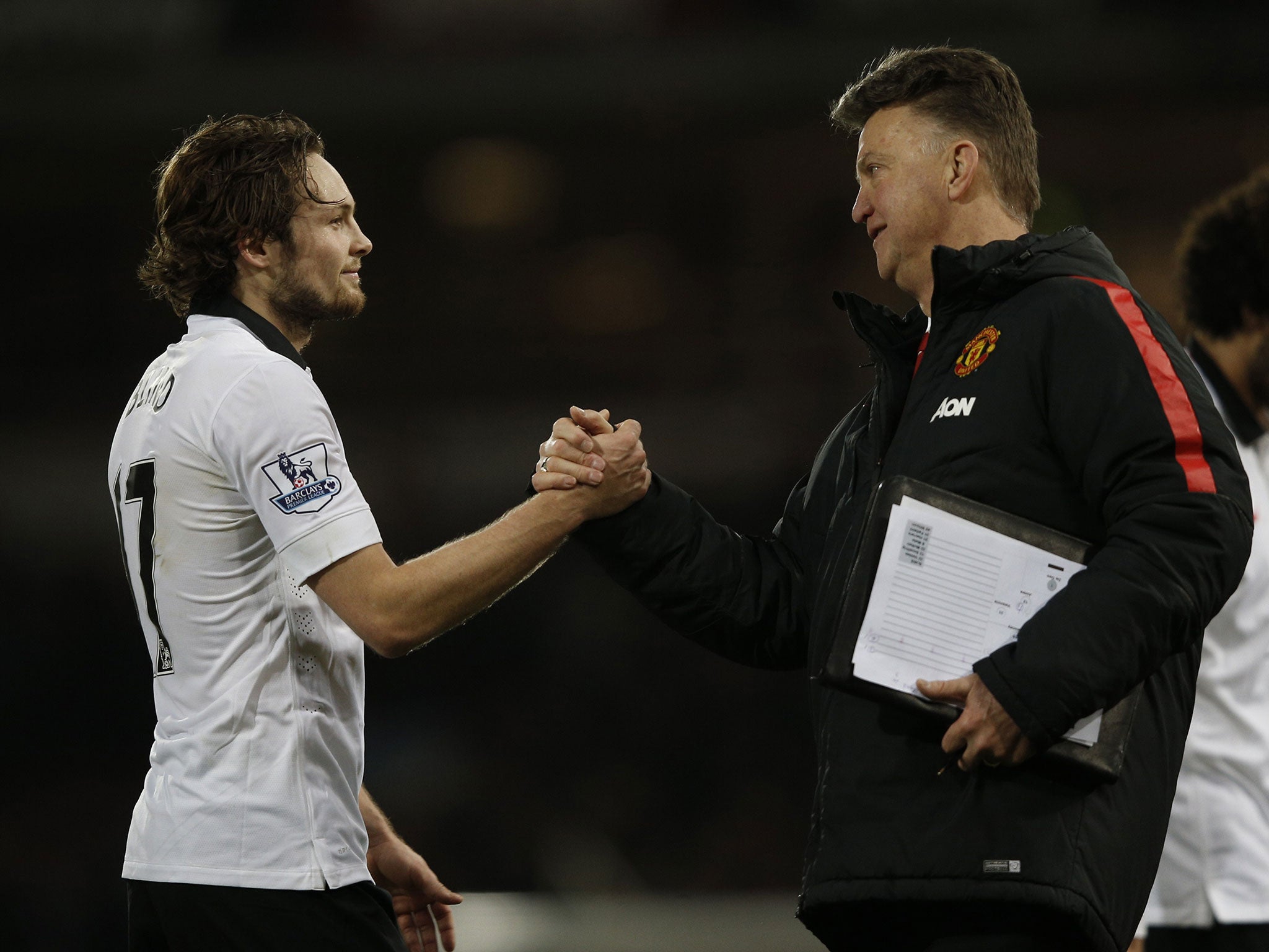 Daley Blind shakes hands with Louis van Gaal after his goal