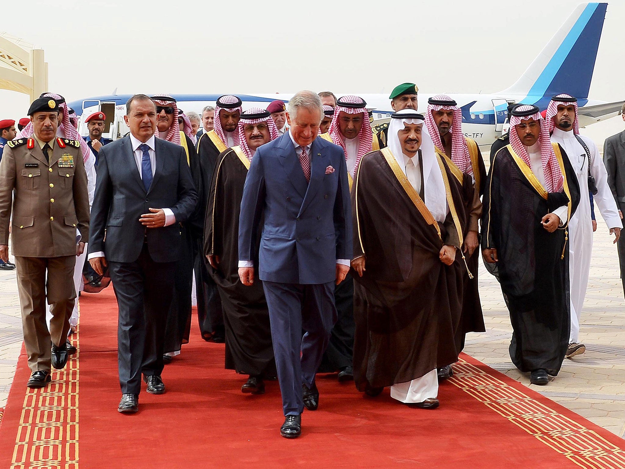 Prince Charles (center - L) being welcomed by the Governor of Riyadh Province, Turki bin Abdullah al-Saud (center - R), upon his arrival at the airport in Riyadh, Saudi Arabia