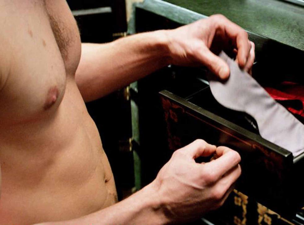 Jamie Dornan's torso features in a scene from the much-anticipated Fifty Shades of Grey movie adaptation