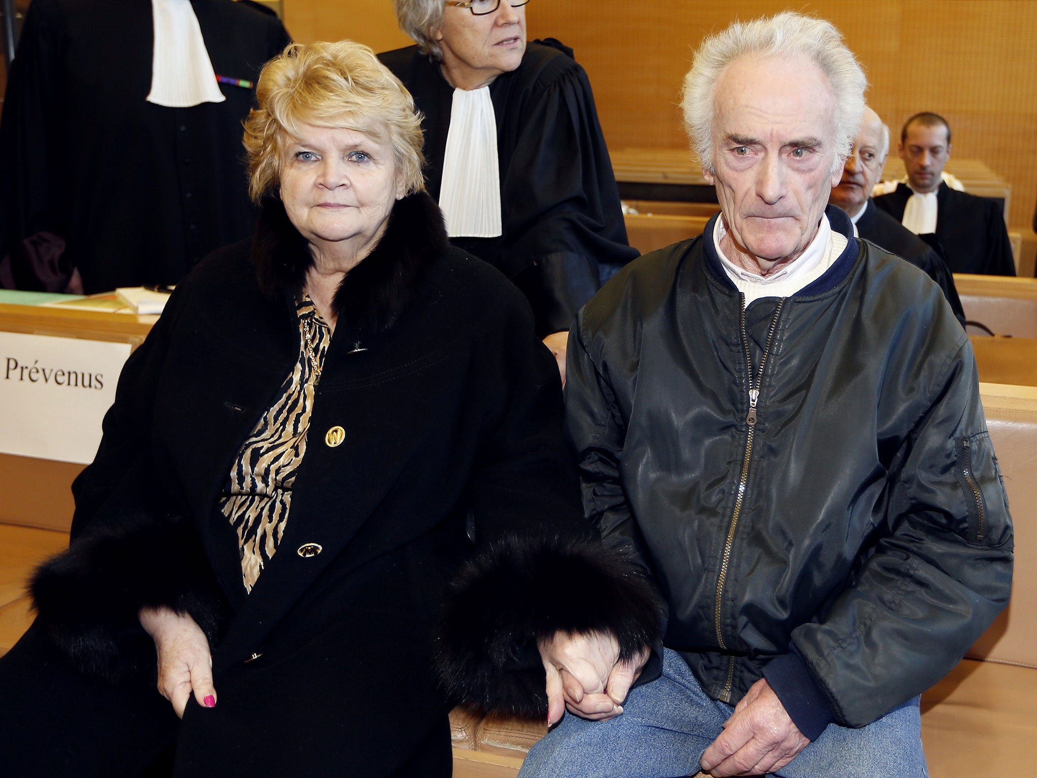 Pierre Le Guennec,who was accused of receiving stolen goods after being found in possession of paintings by late Spanish artist Pablo Picasso, sits with his wife Danielle in court