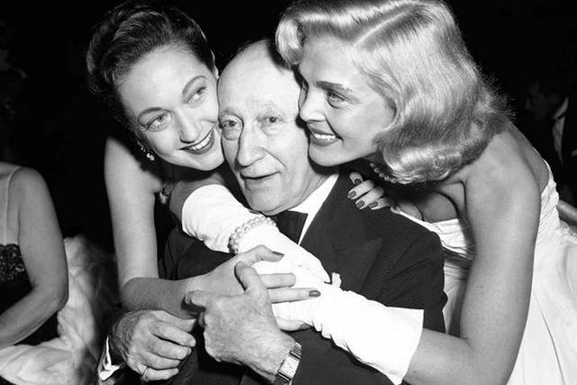 Scott, right, with Dorothy Lamour, gives a birthday hug to the head of Paramount, Adolph Zukor, at an industry dinner in 1953
