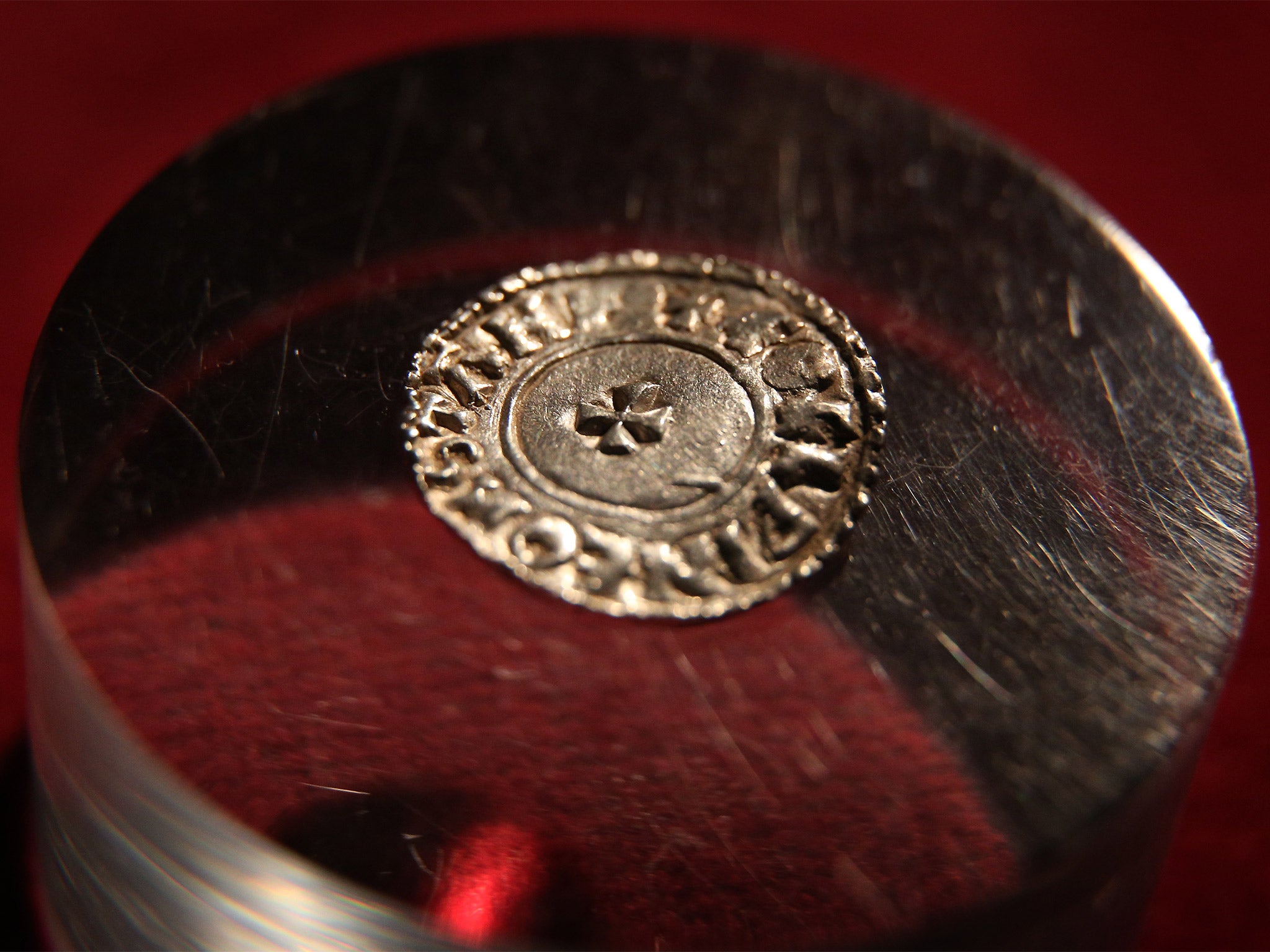 A rare Anglo-Saxon silver penny, with a different imprint on each side, is displayed at The British Museum (Getty)