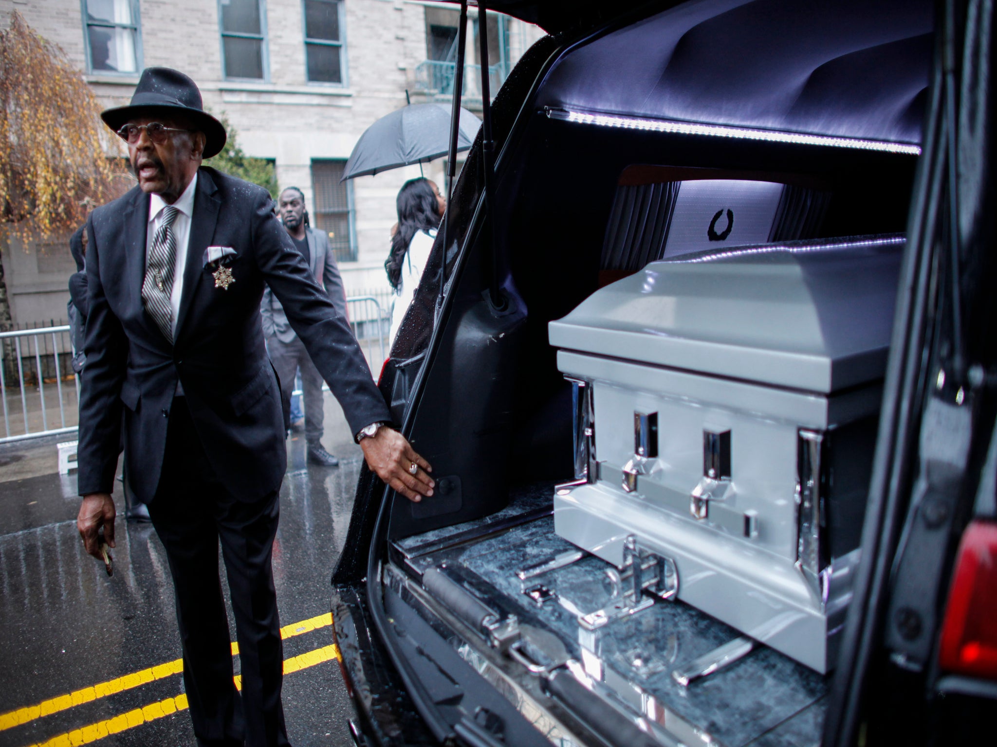 Demonstrators gathered at Akai Gurley's funeral service