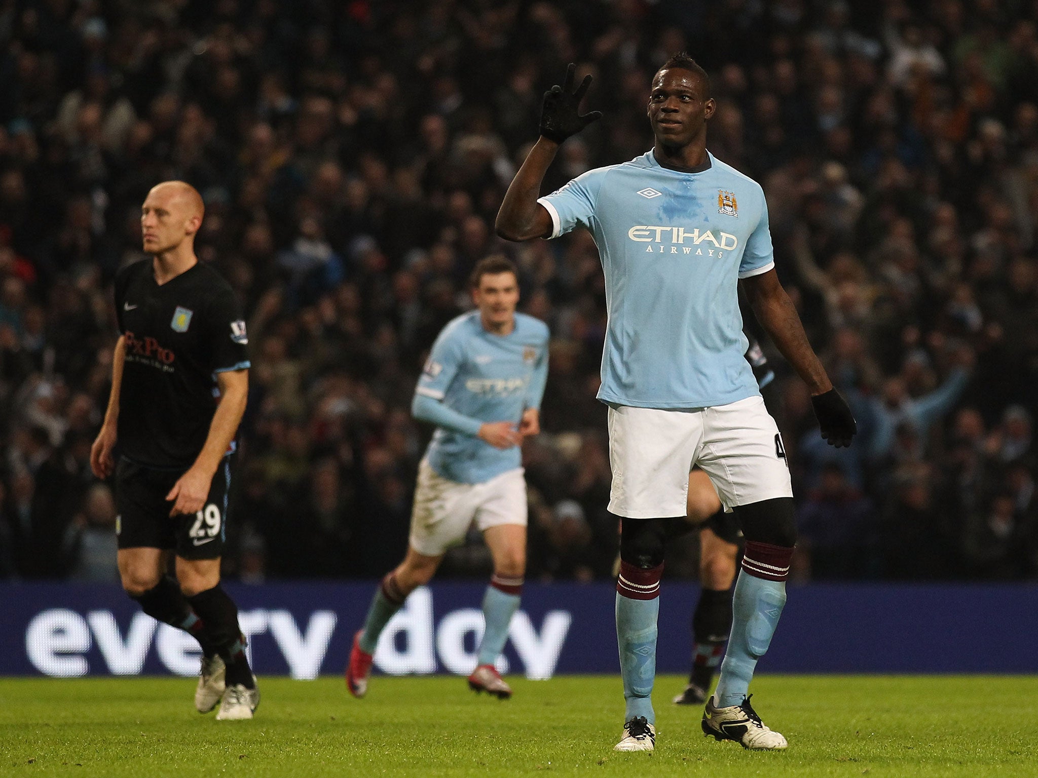 Balotelli reacts after scoring his third goal against Aston Villa in December 2010