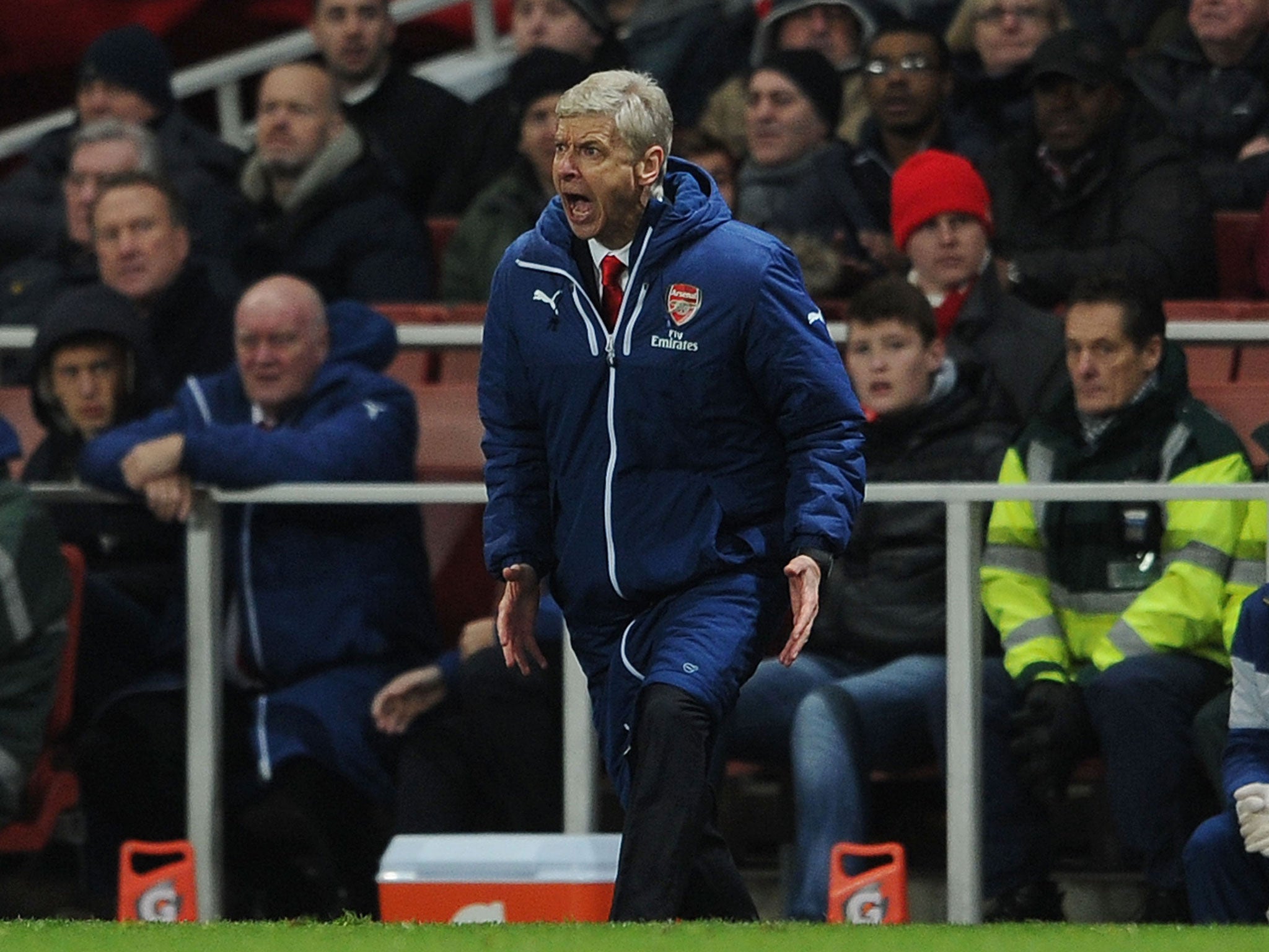 Wenger reacts on the sidelines during Arsenal's win over Leicester