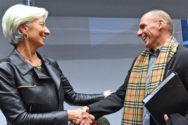 International Monetary Fund director Christine Lagarde greets Greek Finance Minister Yanis Varoufakis