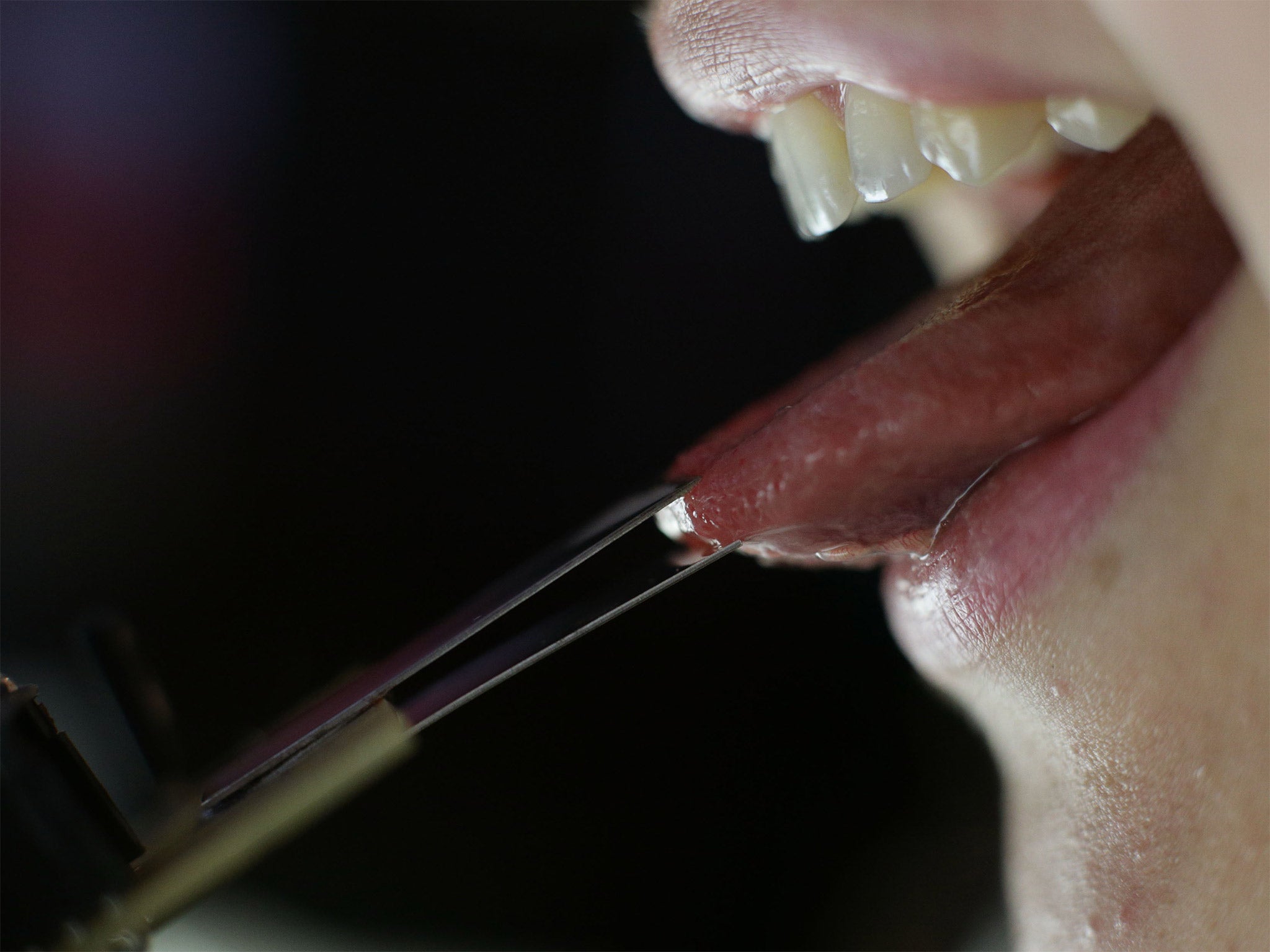 A demonstration of an electronic 'lolly' - which delivers tiny electronic shocks to the tongue to create different tastes