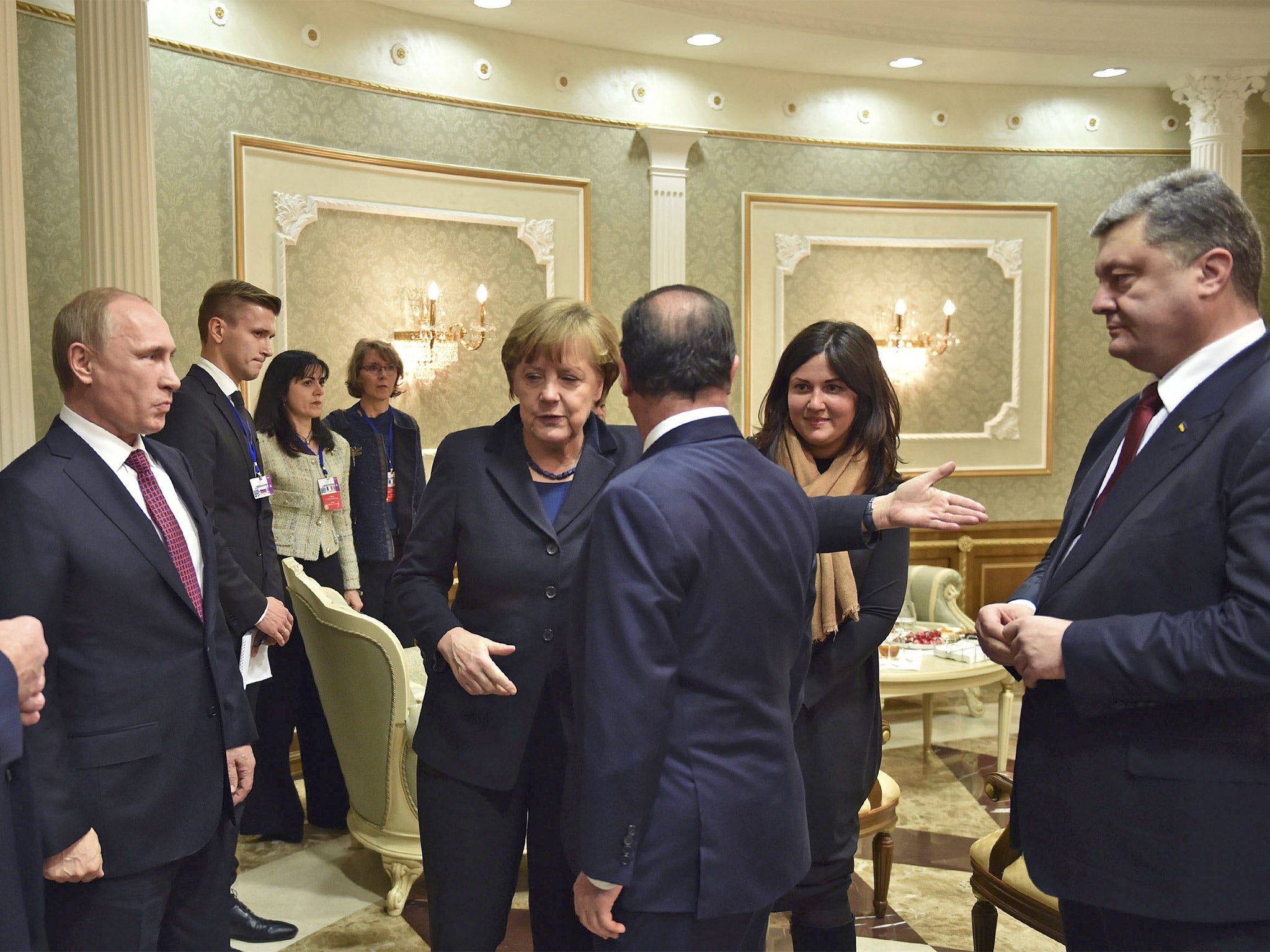 From left: Vladimir Putin, Angela Merkel, François Hollande and Petro Poroshenko in the Belarusian capital on Wednesday night before talks about the violence in Ukraine