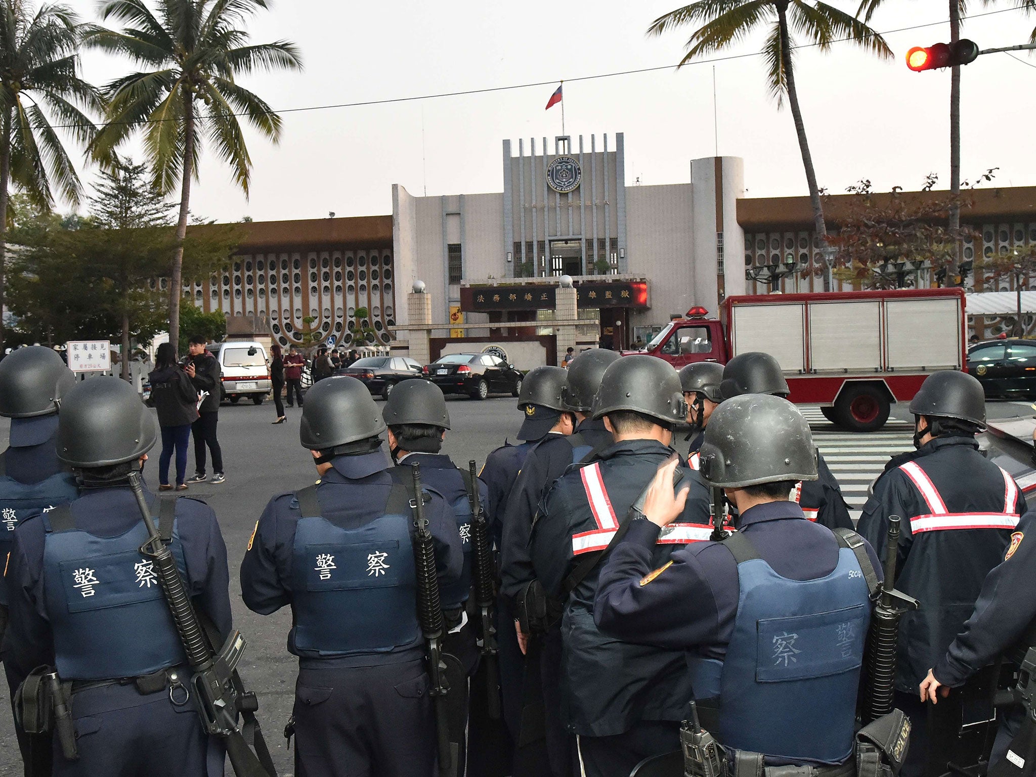 Armed riot police gather outside the Kaohsiung Prison in southern Taiwan on February 11, 2015
