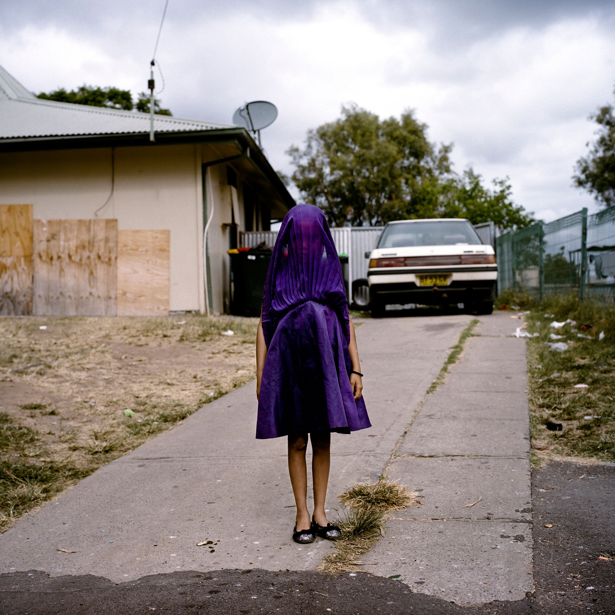 Portrait winner: Laurinda waiting in her purple dress for the bus that will take her to Sunday School in Australia