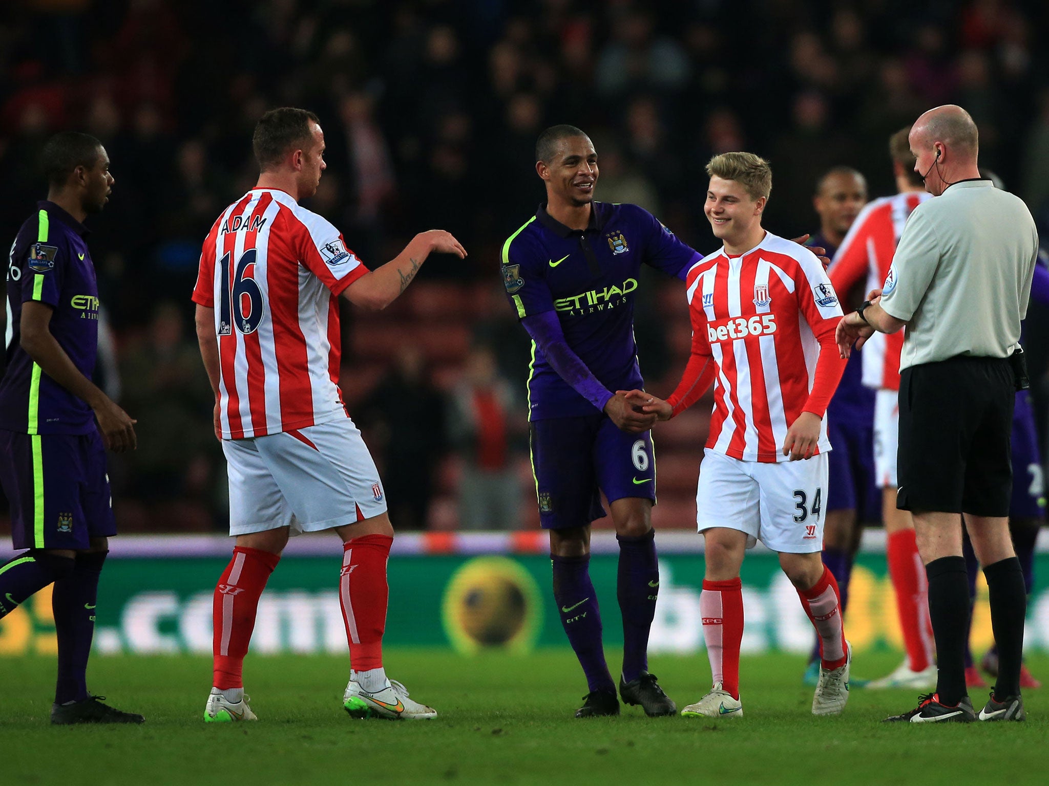 City's Fernando and Stoke's Charlie Adam congratulate Shenton for his debut