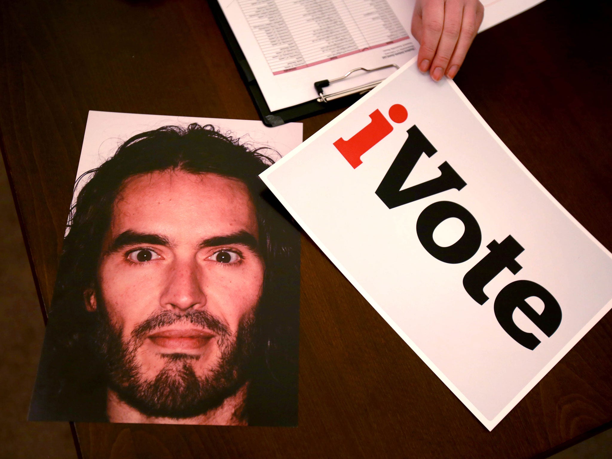 Students used Russell Brand face cards to wave support for motions