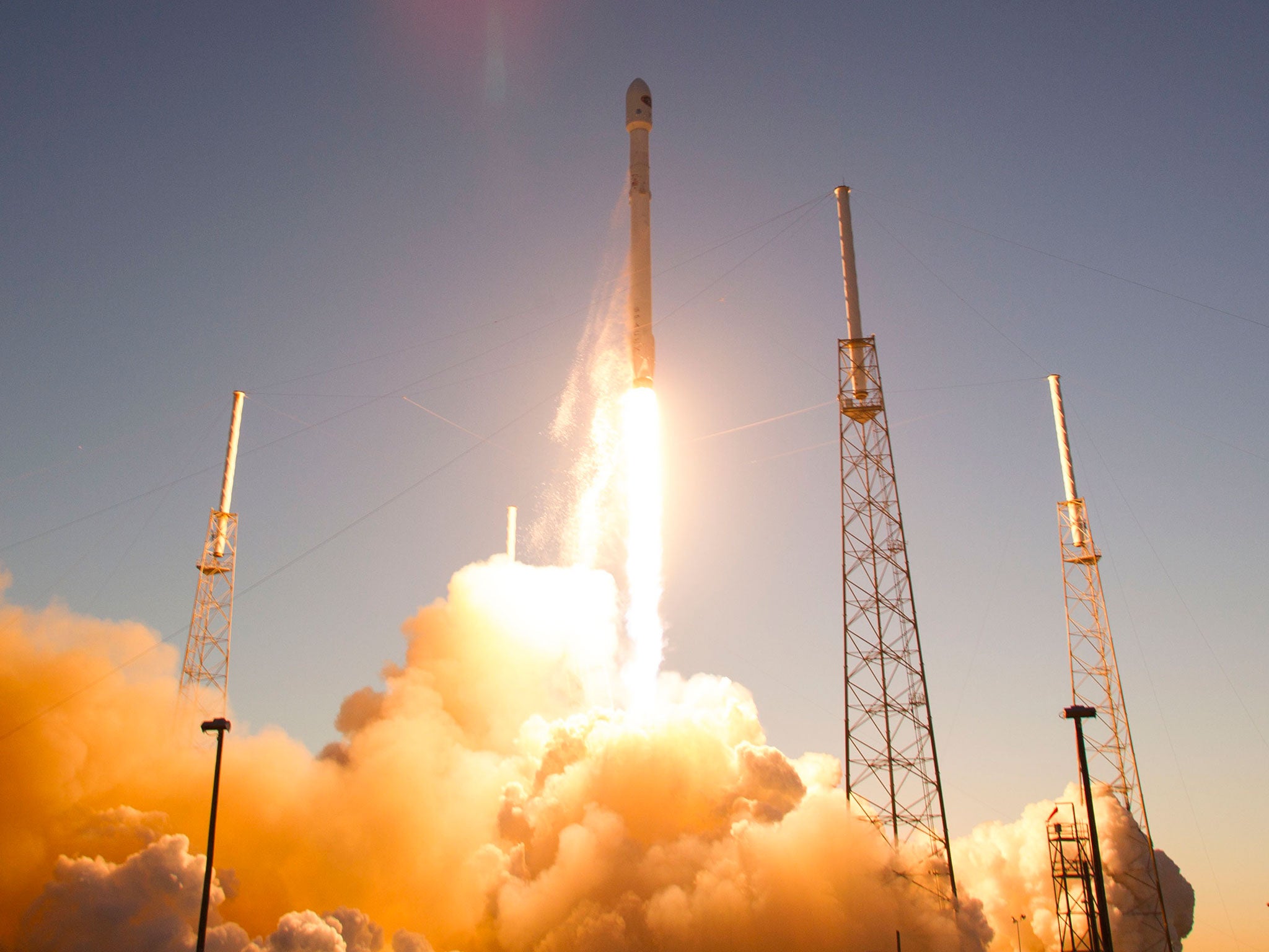 The unmanned Falcon 9 rocket, launched by SpaceX and carrying NOAA's Deep Space Climate Observatory Satellite, lifts off from launch pad 40 the Cape Canaveral Air Force Station in Cape Canaveral, Florida. The rocket blasted off to put the U.S. satellite i