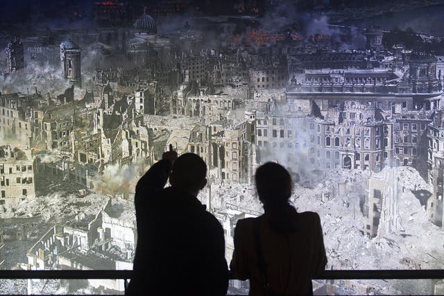 City of dust: visitors to an exhibition in Dresden study a 360-degree panorama of
the city after the Allied raids in February 1945
