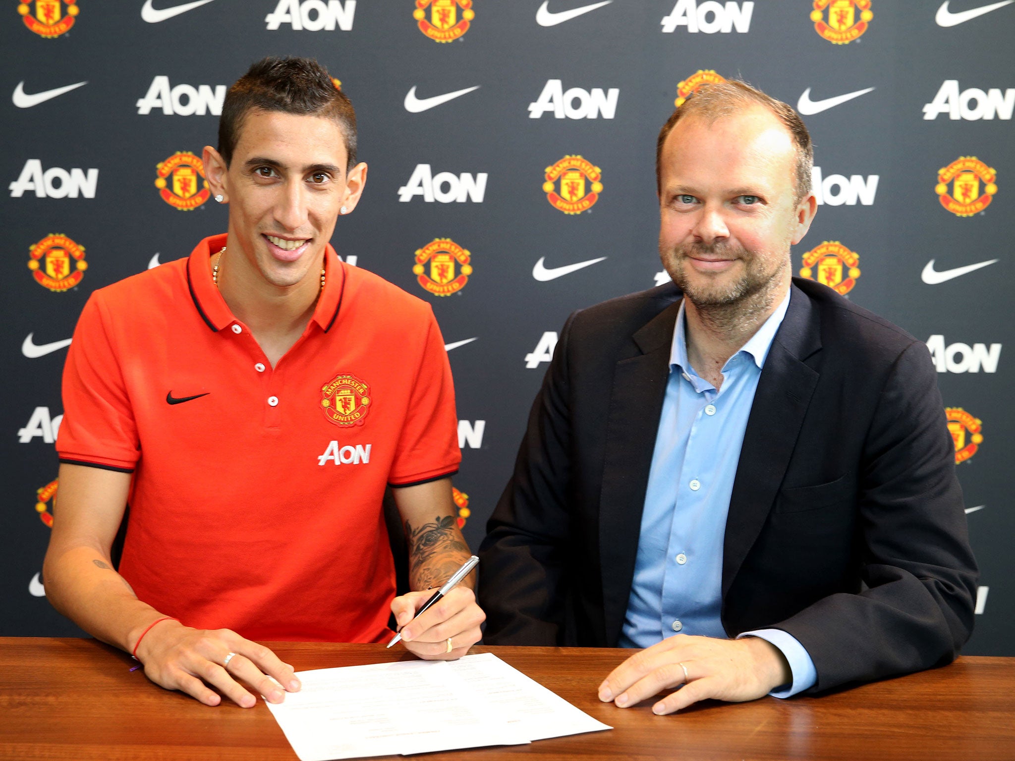 The Manchester United chief executive Ed Woodward (right) with £59.7m signing Angel Di Maria