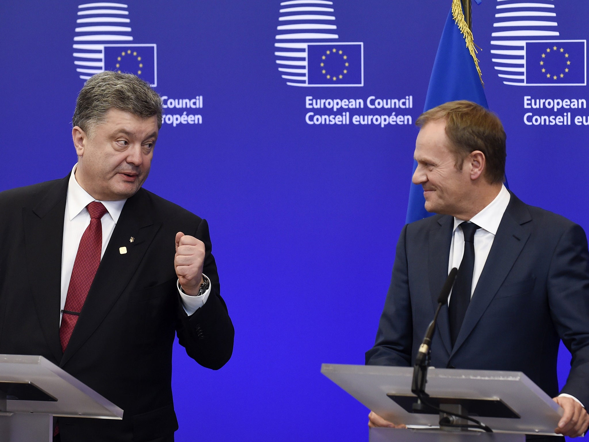 Ukrainian President Petro Poroshenko (left) speaks as President of the European Council Donald Tusk in a joint press conference