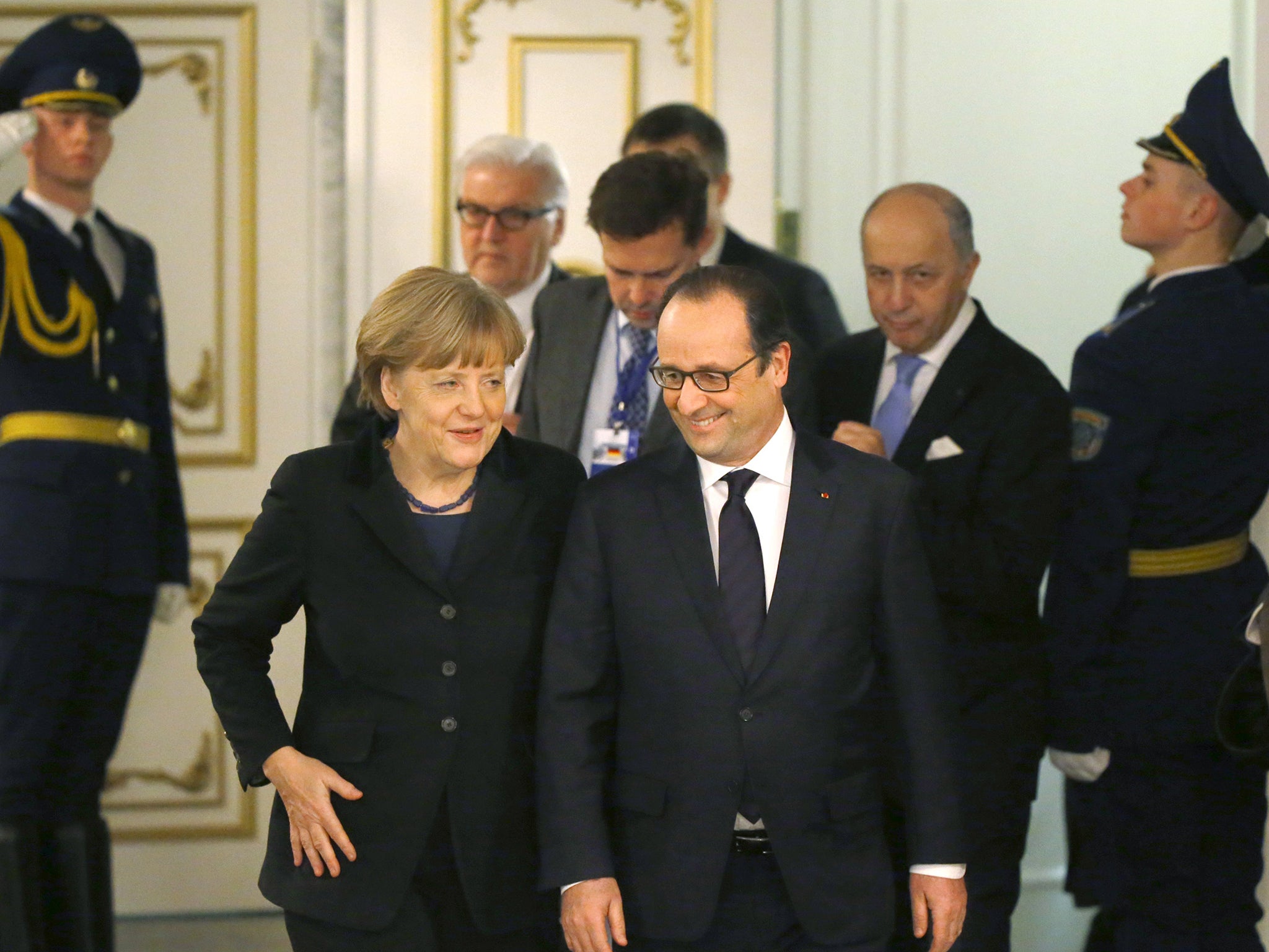 Angela Merkel and François Hollande emerge from their marathon talks in Minsk yesterday