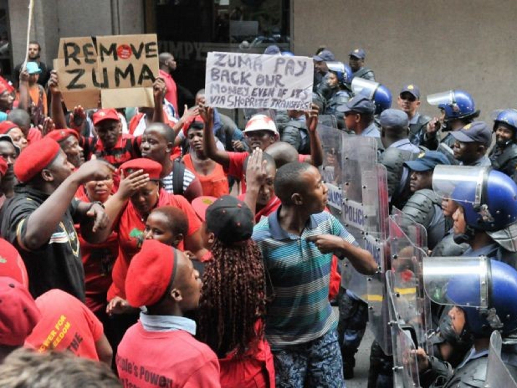 Protesters of the Economic Freedom Fighters confront riot police
