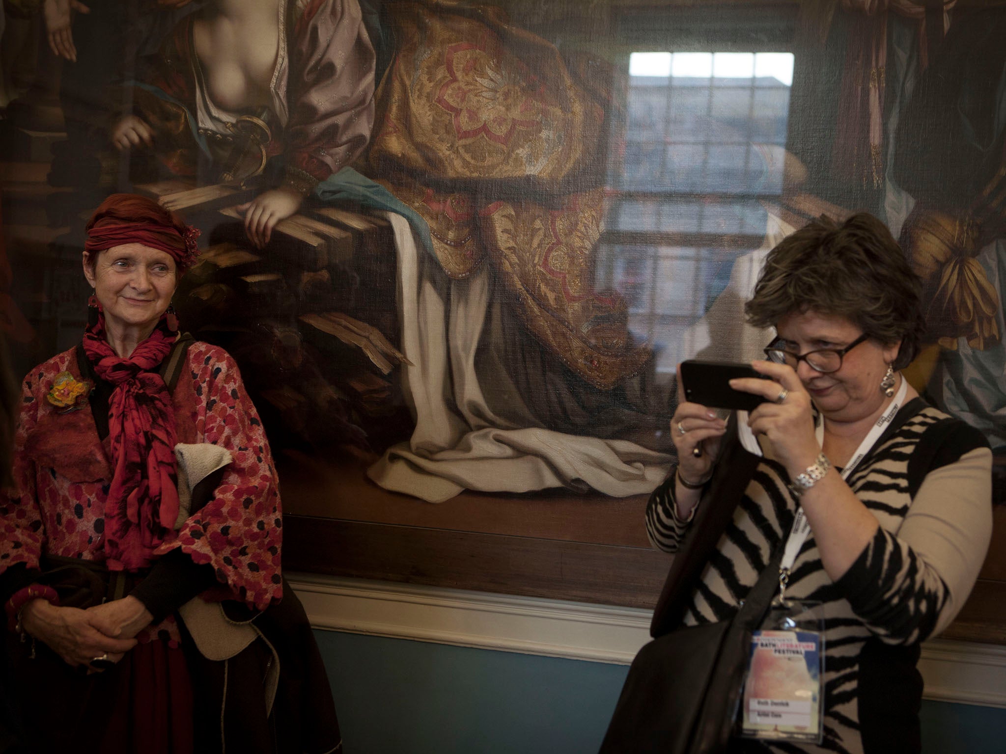 Festival goers photograph Germaine Greer at the Bath Literary festival in 2014. (Copyright Photo Tom Pilston.)